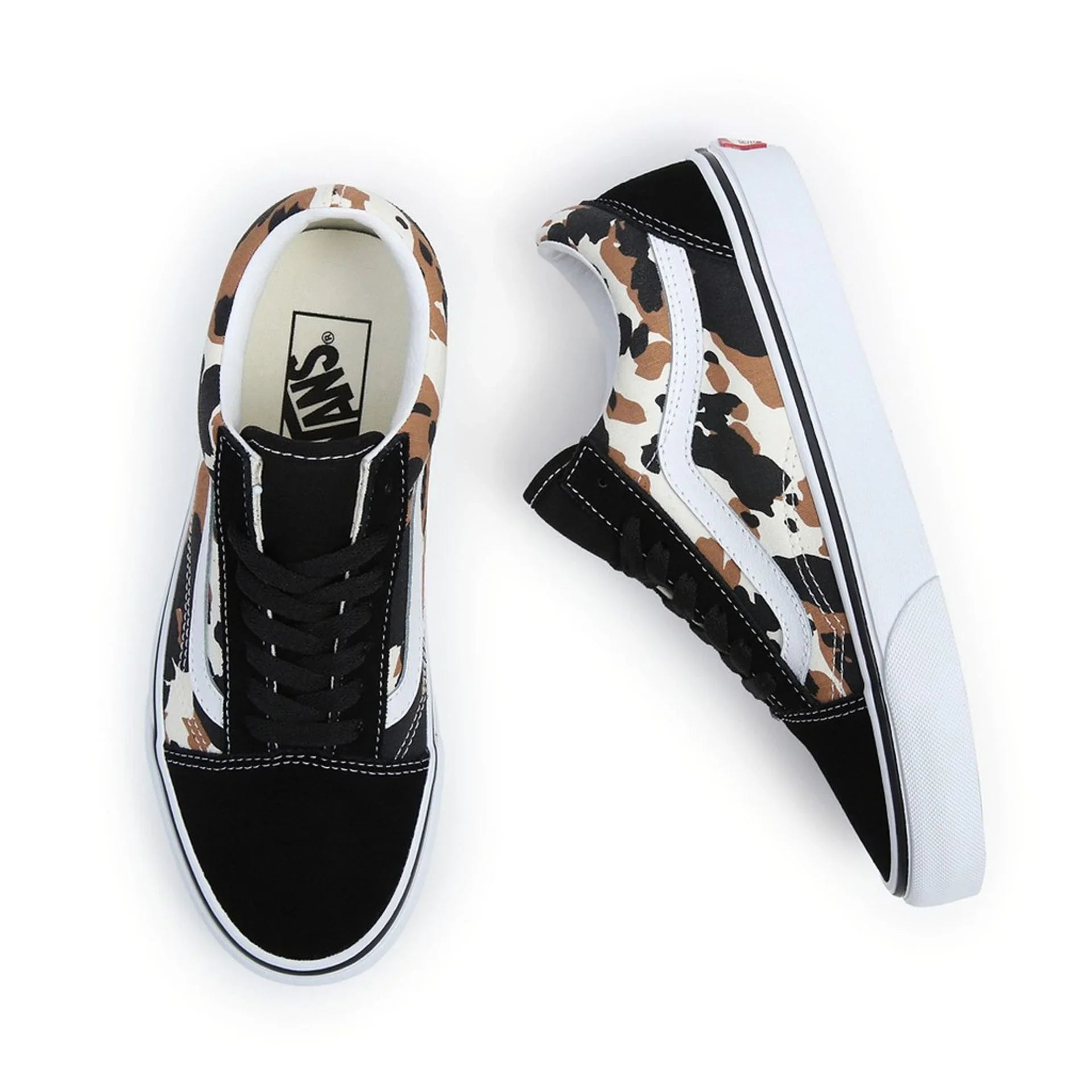 Unisex Vans sneakers with leather upper, round toe, rubber sole, and black, white, and brown camo design accents.
