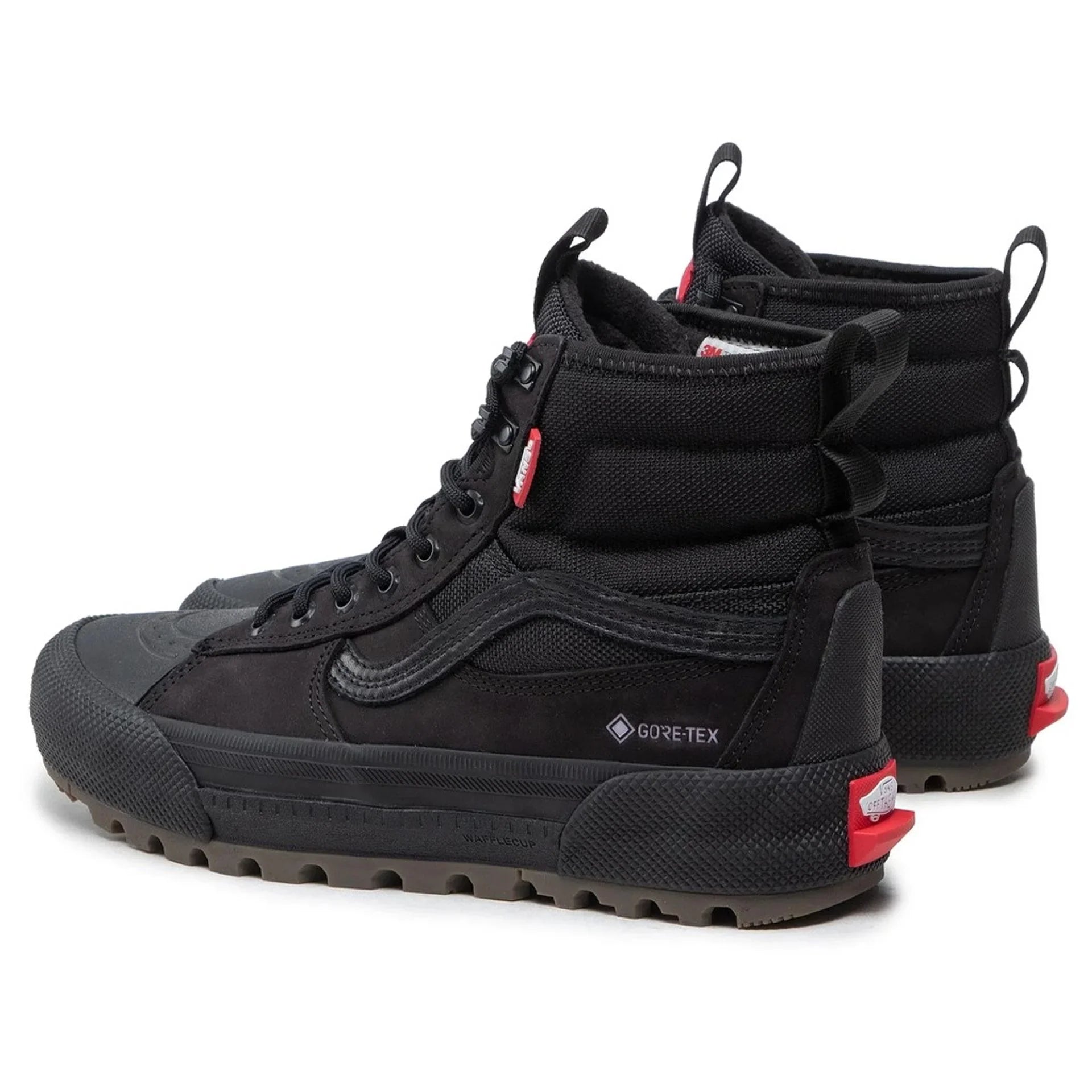 Pair of black Vans unisex sneakers with Gore-Tex, leather upper, rubber sole, and metal eyelets, shown from rear side angle.