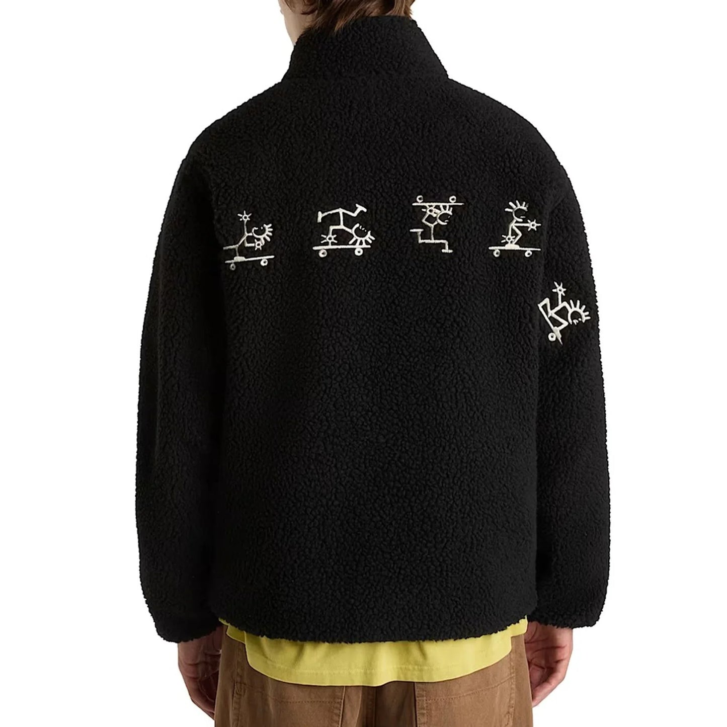 Back view of a black Vans men's fleece jacket with white skateboarding graphic designs on the back